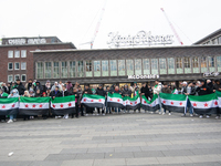 More than a hundred people celebrate post Al Assad in front of Duisburg Central Station in Duisburg, Germany, on December 10, 2024. (