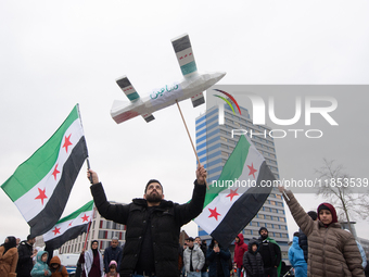 More than a hundred people celebrate post Al Assad in front of Duisburg Central Station in Duisburg, Germany, on December 10, 2024. (