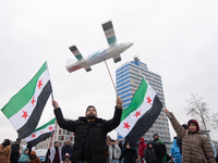 More than a hundred people celebrate post Al Assad in front of Duisburg Central Station in Duisburg, Germany, on December 10, 2024. (