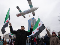 More than a hundred people celebrate post Al Assad in front of Duisburg Central Station in Duisburg, Germany, on December 10, 2024. (