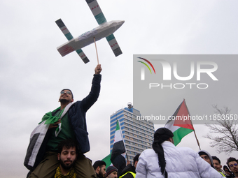 More than a hundred people celebrate post Al Assad in front of Duisburg Central Station in Duisburg, Germany, on December 10, 2024. (