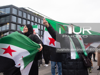 More than a hundred people celebrate post Al Assad in front of Duisburg Central Station in Duisburg, Germany, on December 10, 2024. (