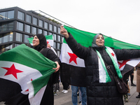 More than a hundred people celebrate post Al Assad in front of Duisburg Central Station in Duisburg, Germany, on December 10, 2024. (