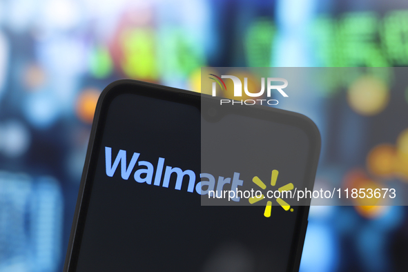 The Walmart, Inc. logo appears on the screen of a smartphone in Reno, United States, on December 10, 2024. (Photo Illustration by Jaque Silv...