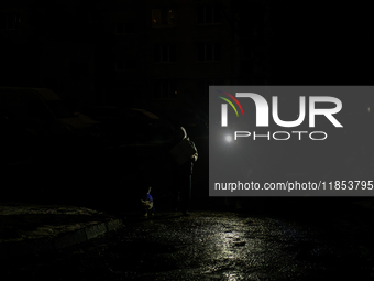 Dark streets and houses during a blackout result from massive Russian missile attacks on Ukraine's energy infrastructure in Kyiv, Ukraine, o...