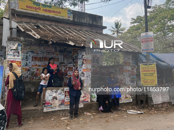 A woman waits at a public bus stand in Nedumangad, Thiruvananthapuram (Trivandrum), Kerala, India, on April 4, 2024. 