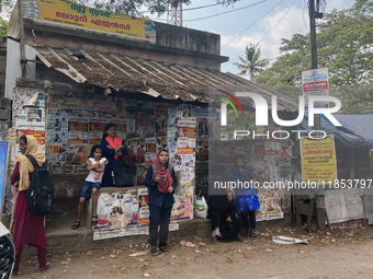 A woman waits at a public bus stand in Nedumangad, Thiruvananthapuram (Trivandrum), Kerala, India, on April 4, 2024. (