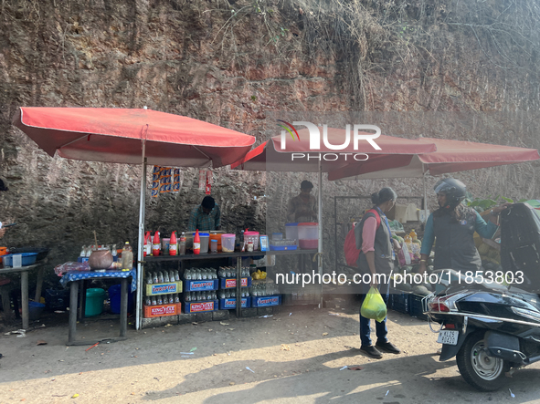 People sell drinks and snacks along the roadside in Punalur, Kollam, Kerala, India, on April 4, 2024. 