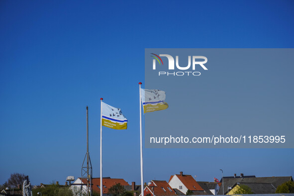 Flags of Wadden Sea National Park are seen in Nordby, Fano Island, Denmark, on April 29, 2024 