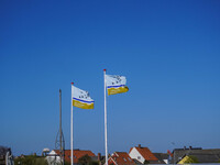 Flags of Wadden Sea National Park are seen in Nordby, Fano Island, Denmark, on April 29, 2024 (