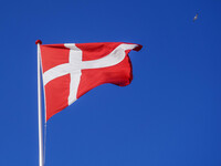 The flag of Denmark is seen blowing in the wind in Nordby, Fano Island, Denmark, on April 29, 2024. (