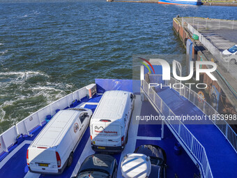 Delivery vans on board a ferry connecting Esbjerg and Fano Island are seen in Nordby, Fano Island, Denmark, on April 29, 2024. (