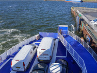 Delivery vans on board a ferry connecting Esbjerg and Fano Island are seen in Nordby, Fano Island, Denmark, on April 29, 2024. (