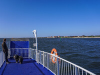 A man with his dog stands waiting on the ferry in Esbjerg, Denmark, on April 29, 2024. (