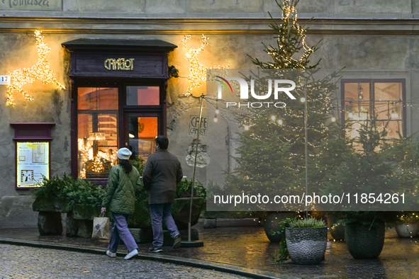 KRAKOW, POLAND - DECEMBER 10:   
A view of Christmas trees and festive decorations outside Camelot Cafe in Krakow’s UNESCO-listed Old Town,...