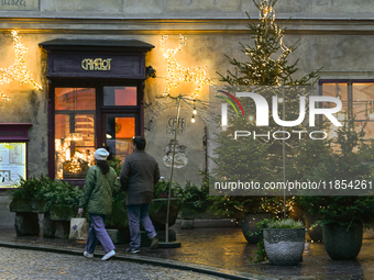 KRAKOW, POLAND - DECEMBER 10:   
A view of Christmas trees and festive decorations outside Camelot Cafe in Krakow’s UNESCO-listed Old Town,...