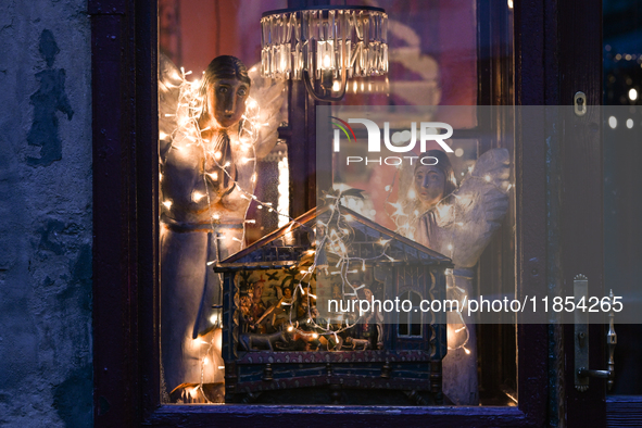 KRAKOW, POLAND - DECEMBER 10:   
A view of Christmas festive decorations adorning the window of Camelot Cafe in Krakow’s UNESCO-listed Old T...