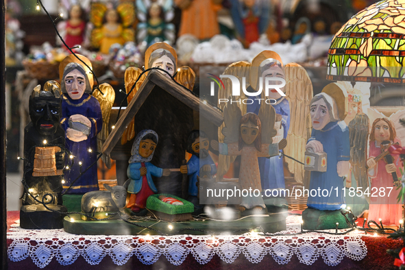 KRAKOW, POLAND - DECEMBER 10:   
A view of a handmade wooden Nativity Scene inside a shop offering local crafts and traditionally handmade p...