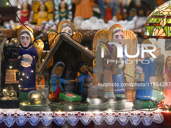 KRAKOW, POLAND - DECEMBER 10:   
A view of a handmade wooden Nativity Scene inside a shop offering local crafts and traditionally handmade p...