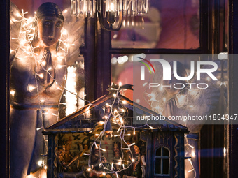 KRAKOW, POLAND - DECEMBER 10:   
A view of Christmas festive decorations adorning the window of Camelot Cafe in Krakow’s UNESCO-listed Old T...