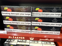 Cartons of cigarettes are at a duty-free shop at Zayed International Airport in Abu Dhabi, United Arab Emirates, on March 28, 2024. (