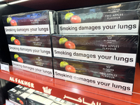 Cartons of cigarettes are at a duty-free shop at Zayed International Airport in Abu Dhabi, United Arab Emirates, on March 28, 2024. (