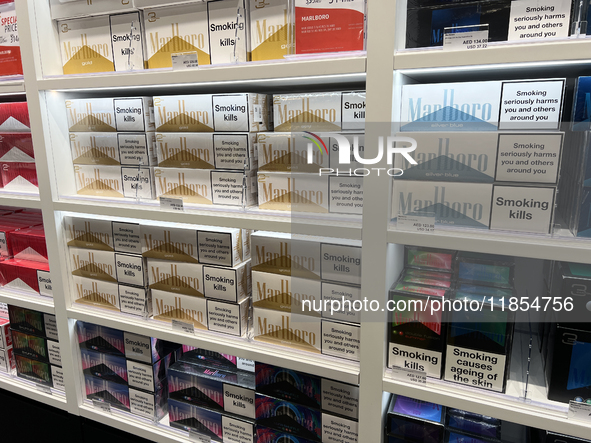 Cartons of cigarettes are at a duty-free shop at Zayed International Airport in Abu Dhabi, United Arab Emirates, on March 28, 2024. 