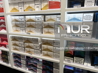 Cartons of cigarettes are at a duty-free shop at Zayed International Airport in Abu Dhabi, United Arab Emirates, on March 28, 2024. (