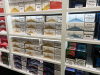 Cartons of cigarettes are at a duty-free shop at Zayed International Airport in Abu Dhabi, United Arab Emirates, on March 28, 2024. (