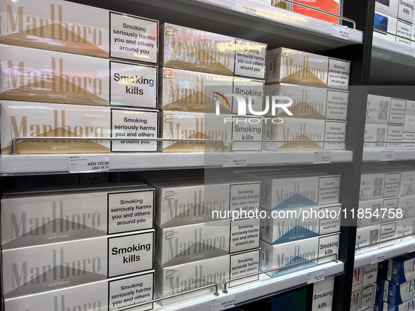 Cartons of cigarettes are at a duty-free shop at Zayed International Airport in Abu Dhabi, United Arab Emirates, on March 28, 2024. 