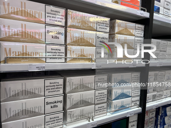 Cartons of cigarettes are at a duty-free shop at Zayed International Airport in Abu Dhabi, United Arab Emirates, on March 28, 2024. (