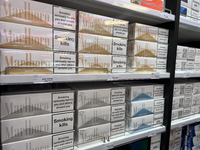 Cartons of cigarettes are at a duty-free shop at Zayed International Airport in Abu Dhabi, United Arab Emirates, on March 28, 2024. (