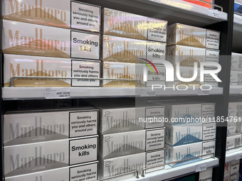 Cartons of cigarettes are at a duty-free shop at Zayed International Airport in Abu Dhabi, United Arab Emirates, on March 28, 2024. (