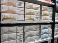 Cartons of cigarettes are at a duty-free shop at Zayed International Airport in Abu Dhabi, United Arab Emirates, on March 28, 2024. (