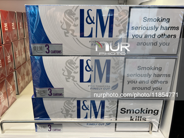 Cartons of cigarettes are at a duty-free shop at Zayed International Airport in Abu Dhabi, United Arab Emirates, on March 28, 2024. 