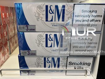 Cartons of cigarettes are at a duty-free shop at Zayed International Airport in Abu Dhabi, United Arab Emirates, on March 28, 2024. (