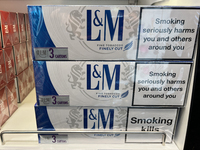 Cartons of cigarettes are at a duty-free shop at Zayed International Airport in Abu Dhabi, United Arab Emirates, on March 28, 2024. (