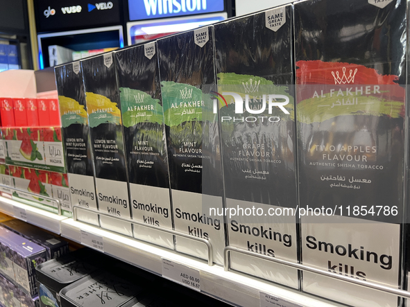 Cartons of cigarettes are at a duty-free shop at Zayed International Airport in Abu Dhabi, United Arab Emirates, on March 28, 2024. 