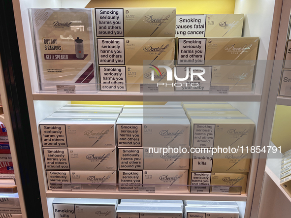 Cartons of cigarettes are at a duty-free shop at Zayed International Airport in Abu Dhabi, United Arab Emirates, on March 28, 2024. 