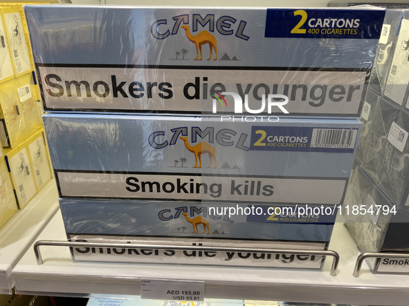 Cartons of cigarettes are at a duty-free shop at Zayed International Airport in Abu Dhabi, United Arab Emirates, on March 28, 2024. 