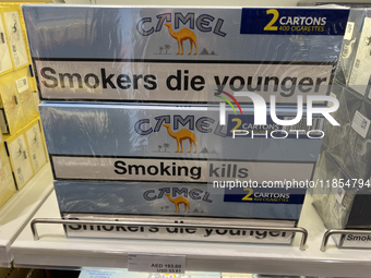 Cartons of cigarettes are at a duty-free shop at Zayed International Airport in Abu Dhabi, United Arab Emirates, on March 28, 2024. (