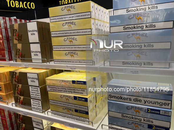 Cartons of cigarettes are at a duty-free shop at Zayed International Airport in Abu Dhabi, United Arab Emirates, on March 28, 2024. 