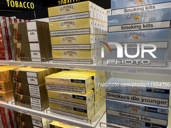 Cartons of cigarettes are at a duty-free shop at Zayed International Airport in Abu Dhabi, United Arab Emirates, on March 28, 2024. (