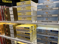 Cartons of cigarettes are at a duty-free shop at Zayed International Airport in Abu Dhabi, United Arab Emirates, on March 28, 2024. (