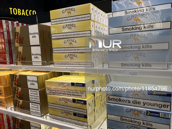 Cartons of cigarettes are at a duty-free shop at Zayed International Airport in Abu Dhabi, United Arab Emirates, on March 28, 2024. 