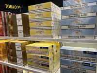 Cartons of cigarettes are at a duty-free shop at Zayed International Airport in Abu Dhabi, United Arab Emirates, on March 28, 2024. (