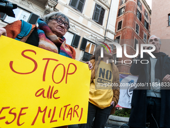 Pacifists protest against the increase in military spending and in favor of human rights in Piazza Capranica near the Chamber of Deputies Pi...