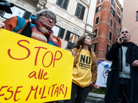 Pacifists protest against the increase in military spending and in favor of human rights in Piazza Capranica near the Chamber of Deputies Pi...