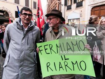 Pacifists protest against the increase in military spending and in favor of human rights in Piazza Capranica near the Chamber of Deputies Pi...