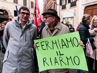 Pacifists protest against the increase in military spending and in favor of human rights in Piazza Capranica near the Chamber of Deputies Pi...